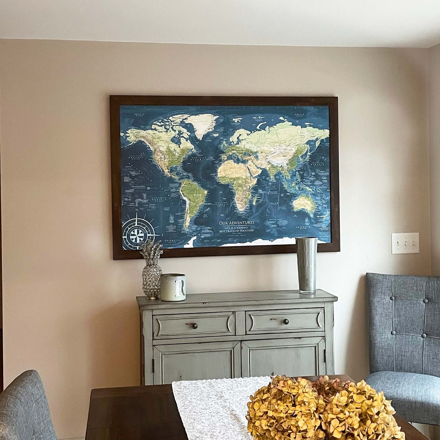 Voyager world push pin map in a dining room