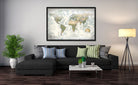 push pin world map canvas displayed in a living room