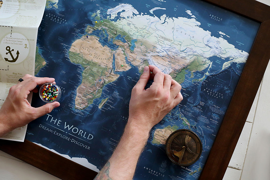 Family around a travel map with pins