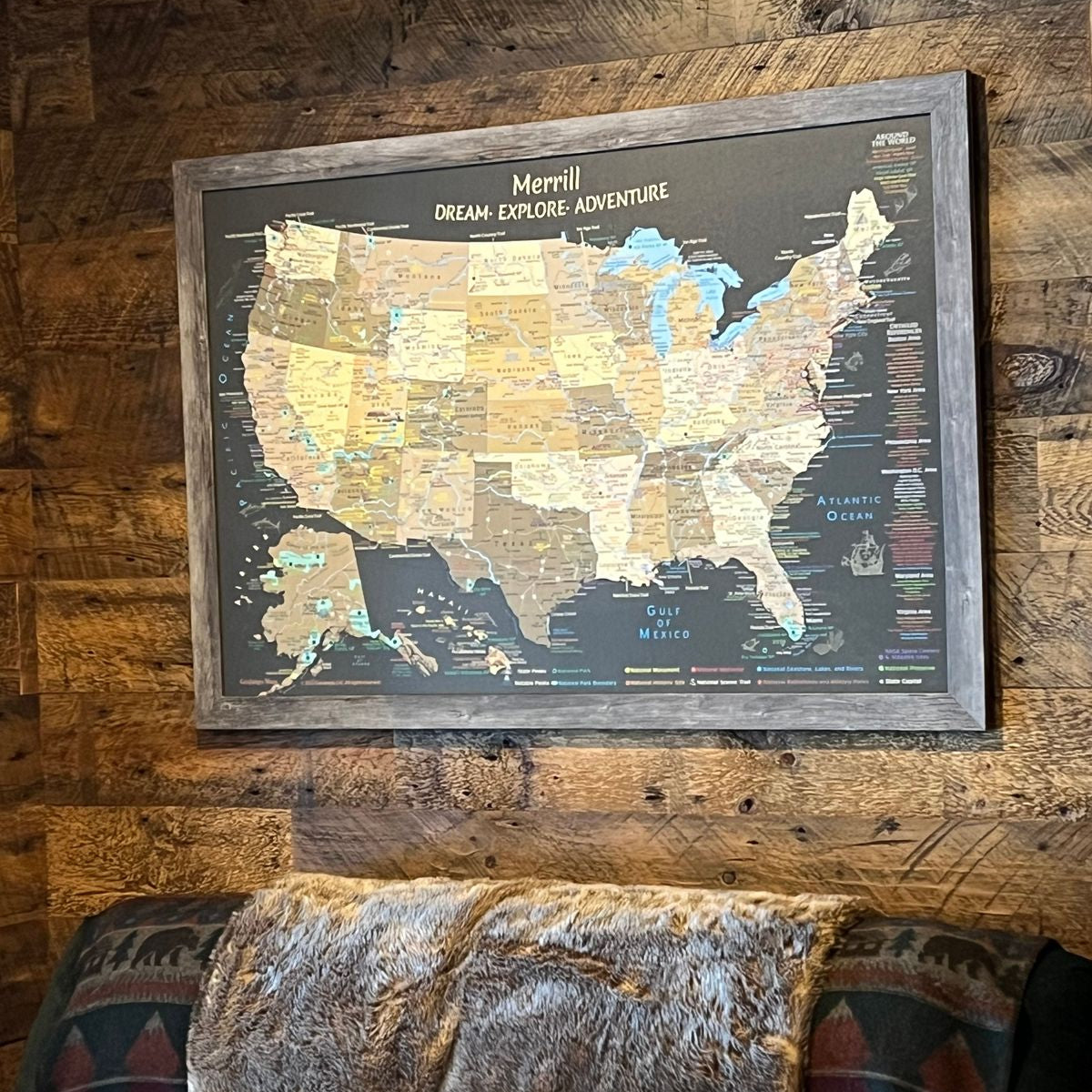 travellers world map USA National Parks push pin map above a couch