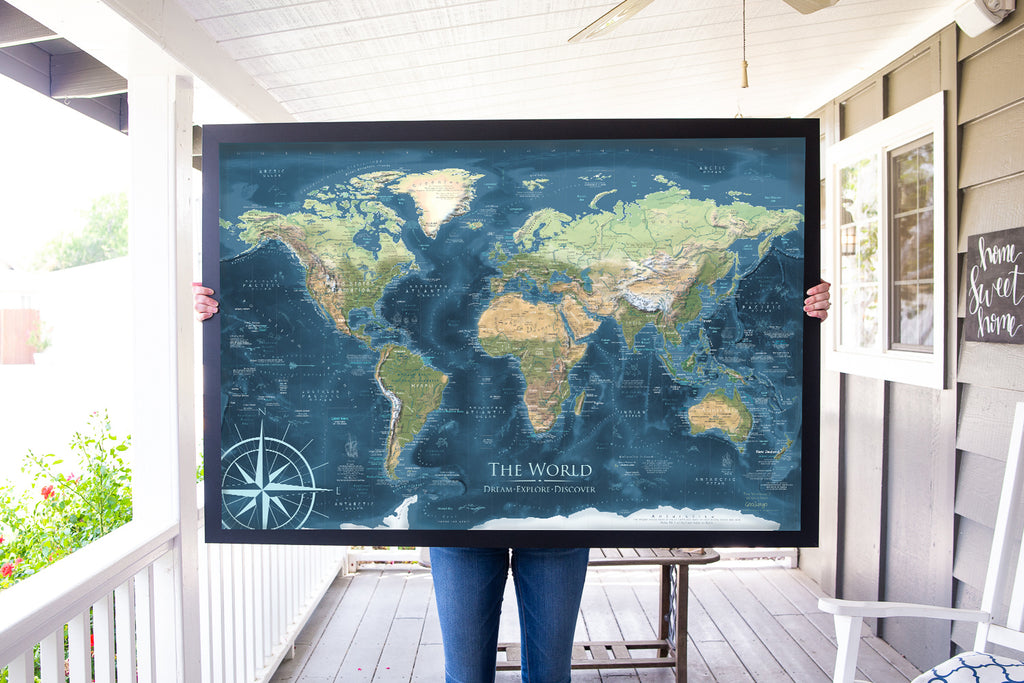 Person holding Giant world map for their home