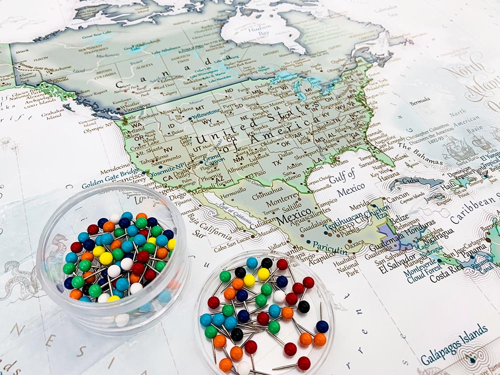 world map with push pins for travels